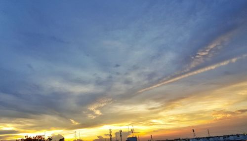 Low angle view of buildings against sky during sunset