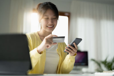 Young woman using mobile phone