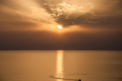 Scenic view of sea against sky at sunset