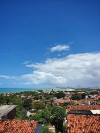 High angle view of townscape against blue sky