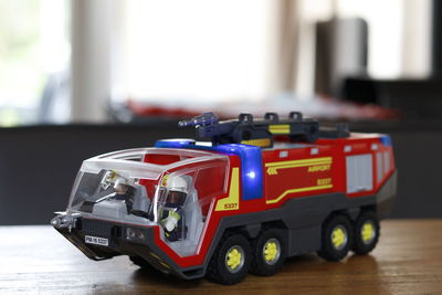 Close-up of toy fire engine on table