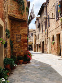 Narrow alley amidst buildings in town