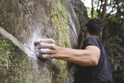 Close up of a rock climber hand on a rock