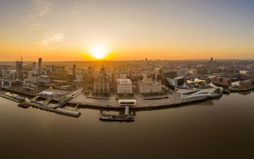 High angle view of buildings against sky during sunset