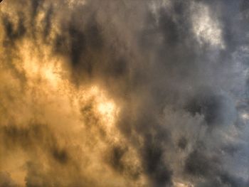 Low angle view of cloudy sky during sunset