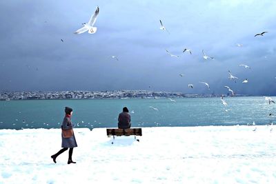 Scenic view of sea against sky during winter