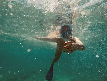 Man swimming in sea