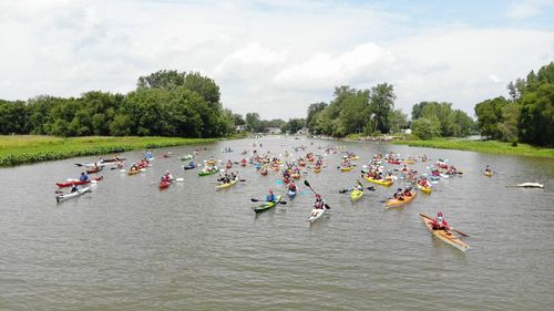 People in water against sky