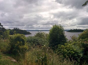 Scenic view of sea against cloudy sky