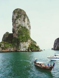 Scenic view of sea and rock formation against sky