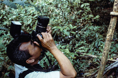 Portrait of man using mobile phone outdoors