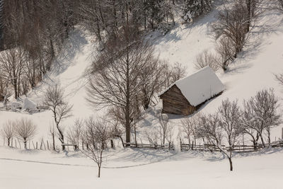 High angle view of wooden barn in winter 