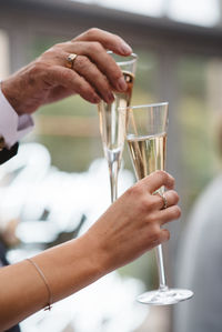 Close-up of hand holding wine glass