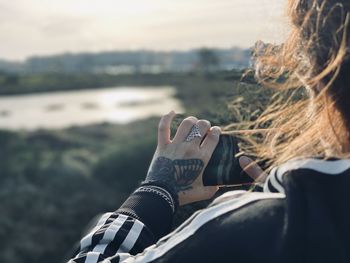 Low section of woman drinking water