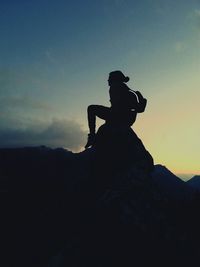 Man photographing at sunset