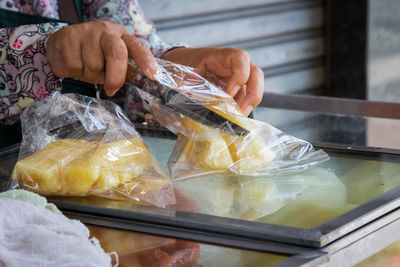 Hand holding fruit for sale