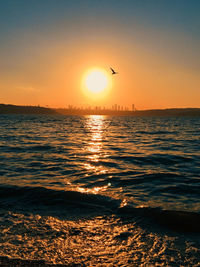 Scenic view of sea against sky during sunset