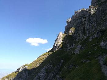 Low angle view of rock formation against sky