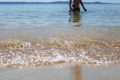 Low section of people on beach