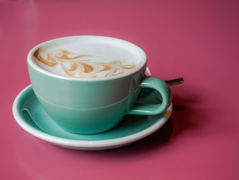 Close-up of coffee cup on table