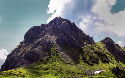 Low angle view of rock formations against sky