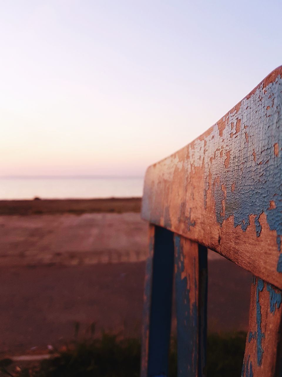 sea, rusty, water, clear sky, metal, no people, outdoors, horizon over water, weathered, nature, day, tranquility, abandoned, scenics, sunset, beach, sky, close-up, built structure, beauty in nature