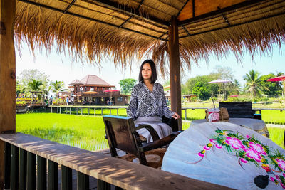 Portrait of woman sitting on seat