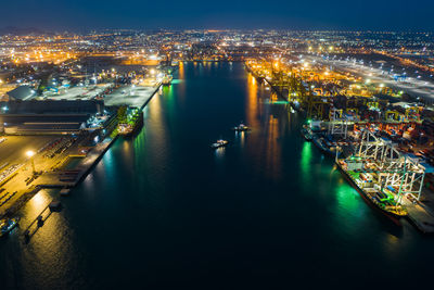 High angle view of city lit up at night