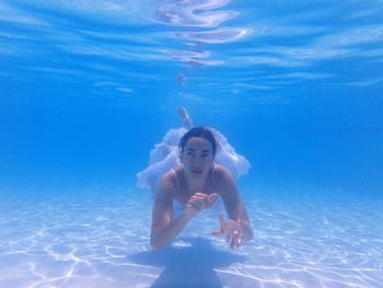 Full length of woman swimming in pool