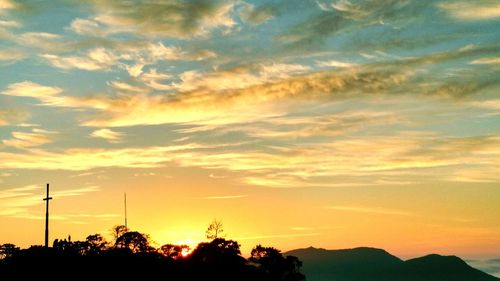 Dramatic sky over silhouette landscape