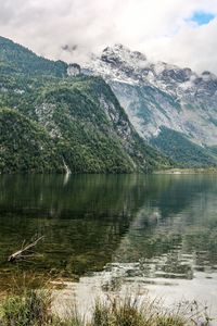 Scenic view of lake and mountains against sky