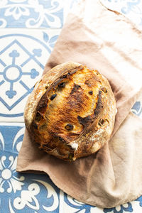 Homemade freshly baked sourdough bread with olives. close up.