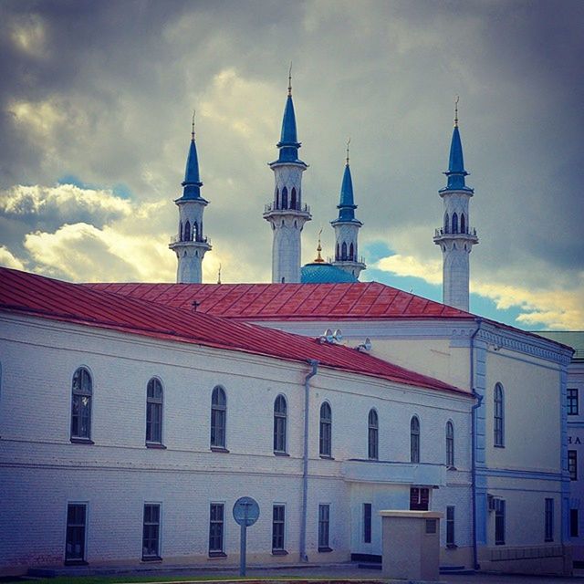 architecture, building exterior, built structure, sky, low angle view, place of worship, church, religion, cloud - sky, spirituality, tower, cloud, dome, outdoors, window, day, cloudy, high section