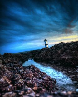 Scenic view of sea against cloudy sky