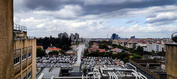 Buildings in city against sky