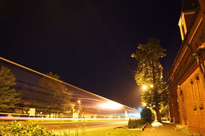 Illuminated city against sky at night