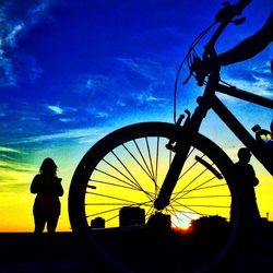 People on road at sunset