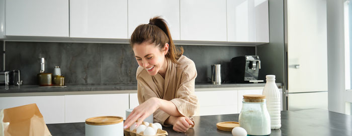 Side view of boy preparing food at home