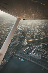 High angle view of cityscape seen through airplane window