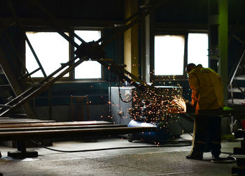 Rear view of man working