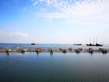 Scenic view of pier on sea against sky