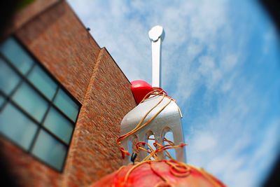 Low angle view of lamp post against sky