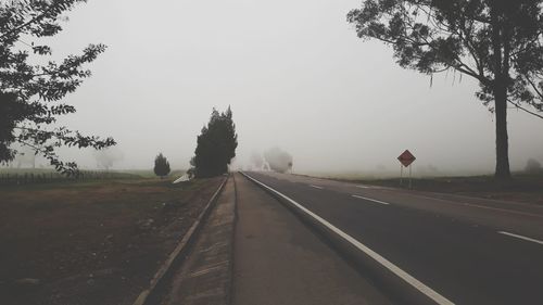 Road on field against sky