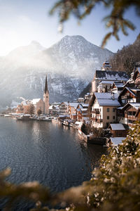 View of buildings and mountain in winter