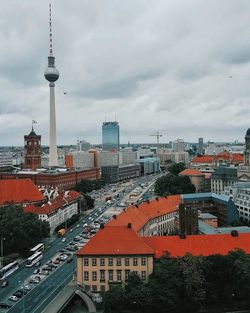 Cityscape against cloudy sky