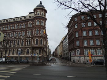 Road along buildings in city