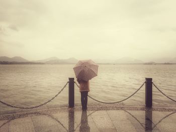 Scenic view of sea against cloudy sky