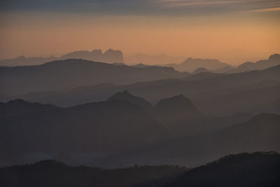 Scenic view of silhouette mountains against sky during sunset