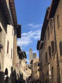 Low angle view of buildings against blue sky