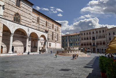 Group of people in front of historical building